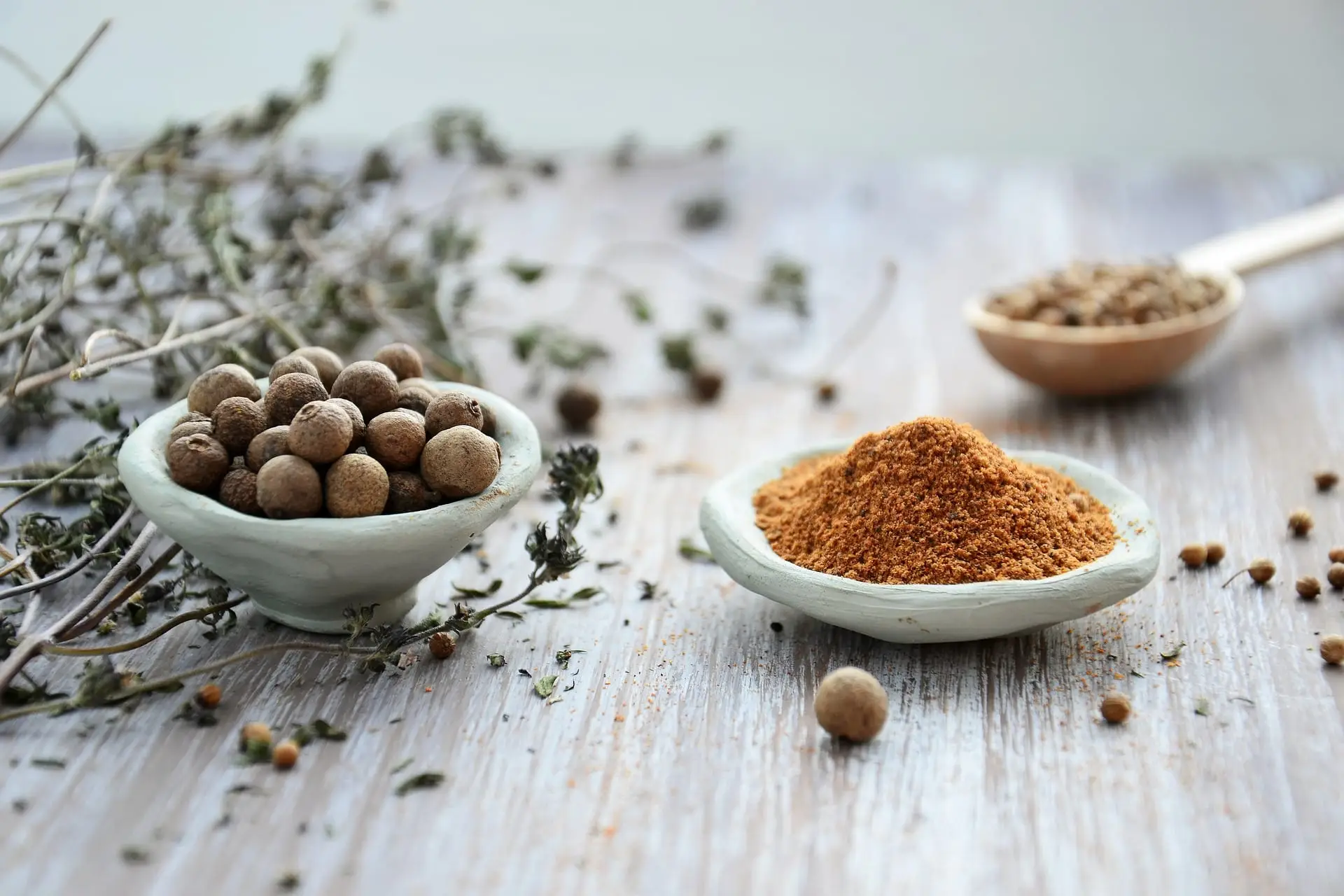 Whole and ground spices in bowls